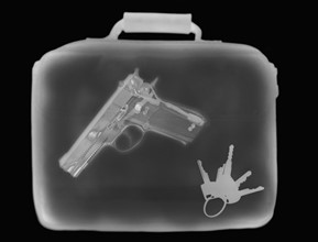 X-ray image showing handbag containing pistol and set of keys. 
Photo: Calysta Images
