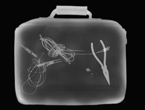 X-ray image showing briefcase containing suspect device. 
Photo: Calysta Images