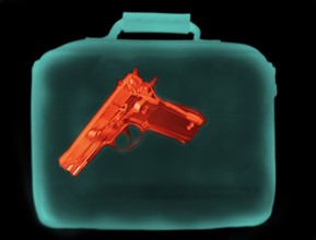 X-ray image showing handbag containing pistol. 
Photo: Calysta Images