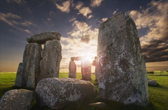UK, England, Wiltshire, Stonehenge at sunset.