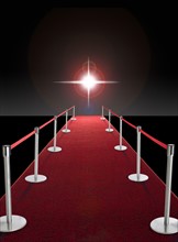 Glowing star above red carpet.