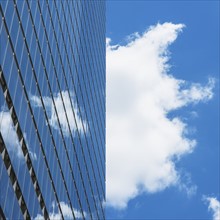 USA, New York City, Sky reflecting in World Trade Tower windows.