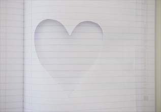 Heart shape cut out of note book. Photo: Jamie Grill