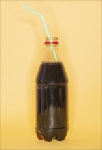 Studio shot of bottles of cola. Photo : Daniel Grill