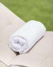 Folded towel on lounger. Photo : Daniel Grill