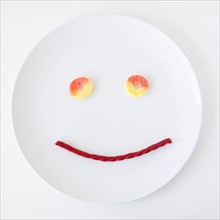 Smiley face on plate made out of jelly beans. Photo: Jessica Peterson