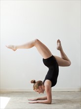 Teenage (16-17) gymnast exercising. Photo: Jessica Peterson