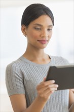 Woman holding digital tablet.