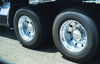 Wheels of truck in motion.