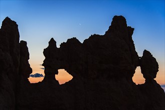 Silhouette of rock at dusk.