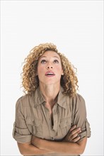 Portrait of young woman on white background, studio shot.