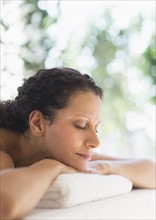 Woman relaxing in spa.