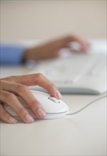 Human hand with computer mouse.