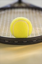 Studio Shot of tennis racket with ball. Photo: Daniel Grill