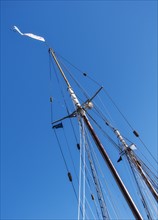 Low angle view of yacht mast against blue sky. Photo: Daniel Grill