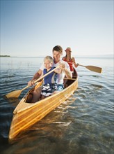 Family with son (4-5) canoe traveling.