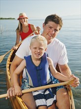 Portrait of family with son (4-5) canoe traveling.