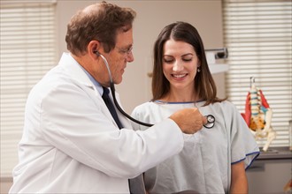 Doctor checking patients heart rate with Stethoscope. Photo: Mike Kemp