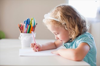 Girl drawing with colours. Photo: Jessica Peterson