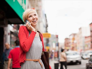 Woman smiling and talking on phone. Photo : Jessica Peterson