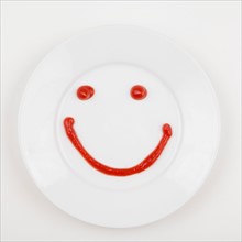 Plate with smiley face made of ketchup. Photo: Jessica Peterson