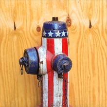Fire hydrant with American flag pattern.