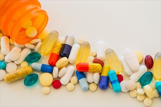 Colorful pills on white background.