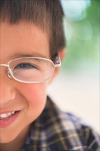 Portrait of boy (6-7) wearing glasses.