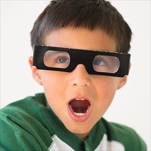 Portrait of boy (6-7) wearing 3d glasses.