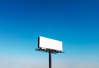 Billboard under blue sky.