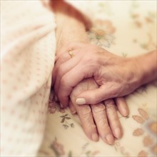 Hands of elderly people.