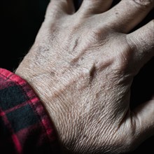 Close-up of senior's hand.