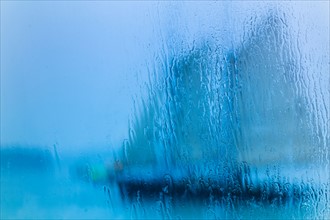 Schooner seen through wet window. Portland, Maine.