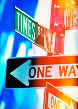 Directional signs at night. New York City, New York.