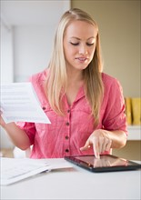 Young woman using digital tablet