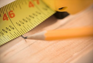 Close-up of tape measure and pencil