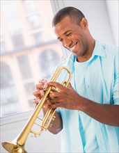 Young man playing trombone
