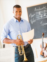 Music teacher with trombone