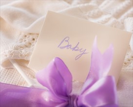 Close-up of envelope and purple bow