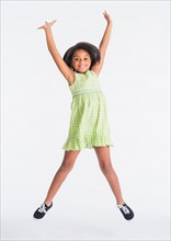Studio shot of jumping girl (6-7 years)