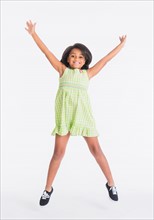 Studio shot of jumping girl (6-7 years)