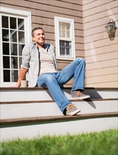 Portrait of man relaxing on steps