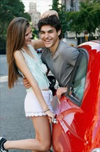 Young couple embracing on street