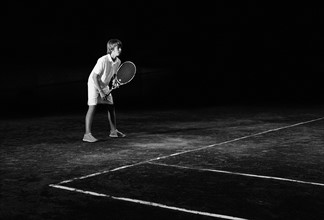 Boy playing tennis