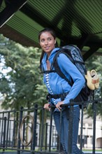 Portrait of young woman with backpack. Photo: Jan Scherders