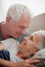 Senior couple smiling and embracing. Photo: Rob Lewine