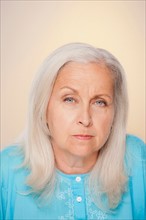 Portrait of senior woman with suspicious face expression. Photo : Rob Lewine