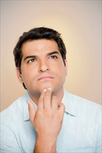 Portrait of man looking up. Photo : Rob Lewine