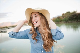 Portrait of young woman wearing hat. Photo : Jessica Peterson