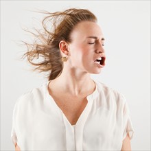 Studio shot of woman with windblown mouth. Photo: Jessica Peterson